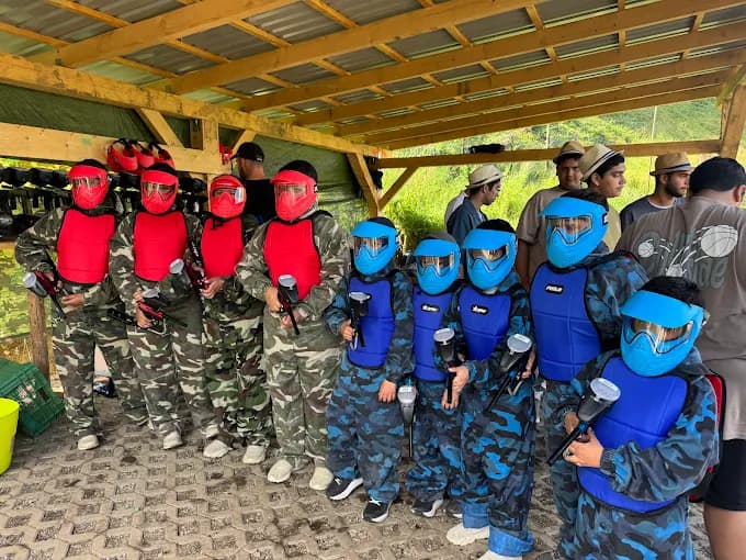 Players in full paintball gear