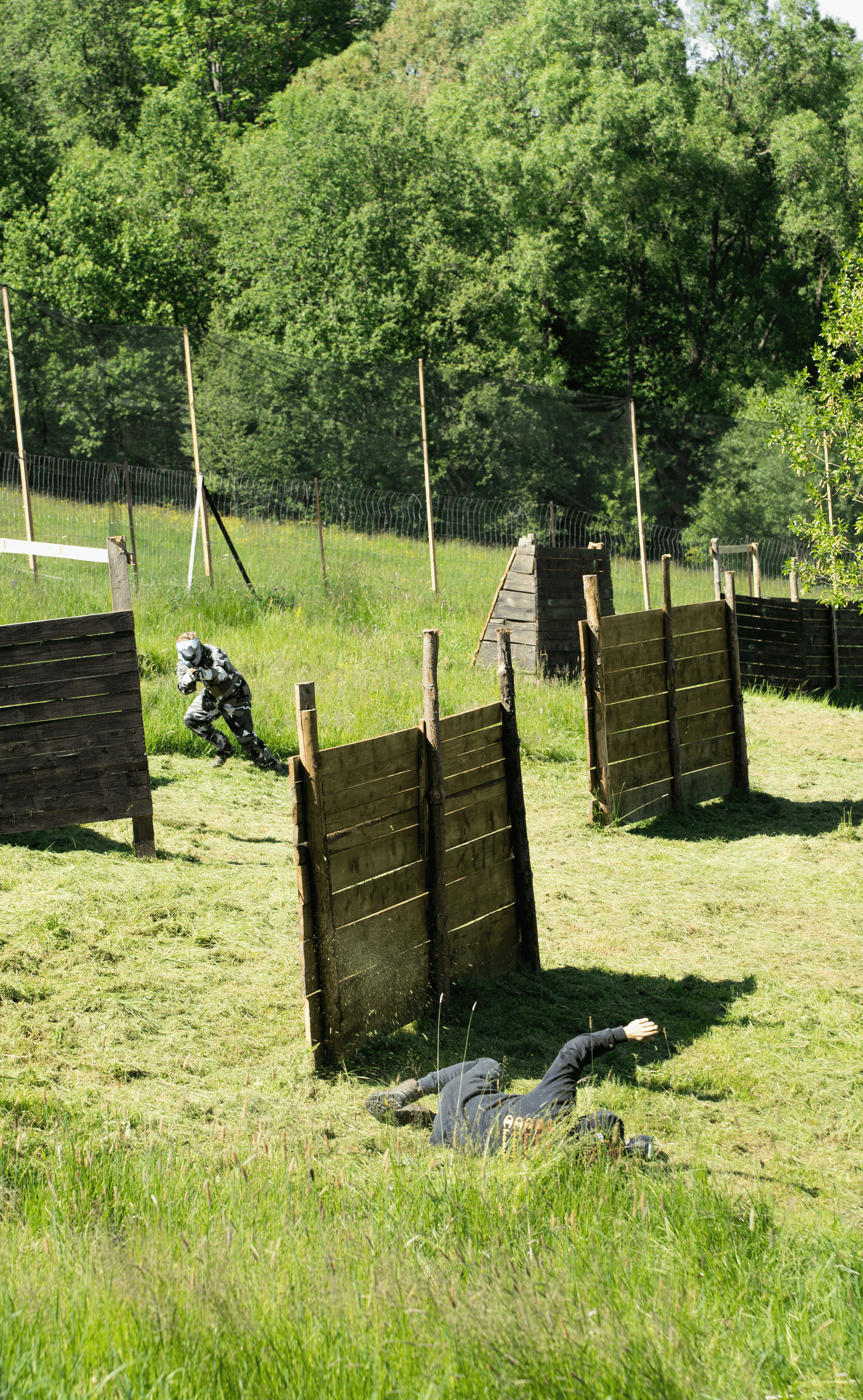 Players in full paintball gear